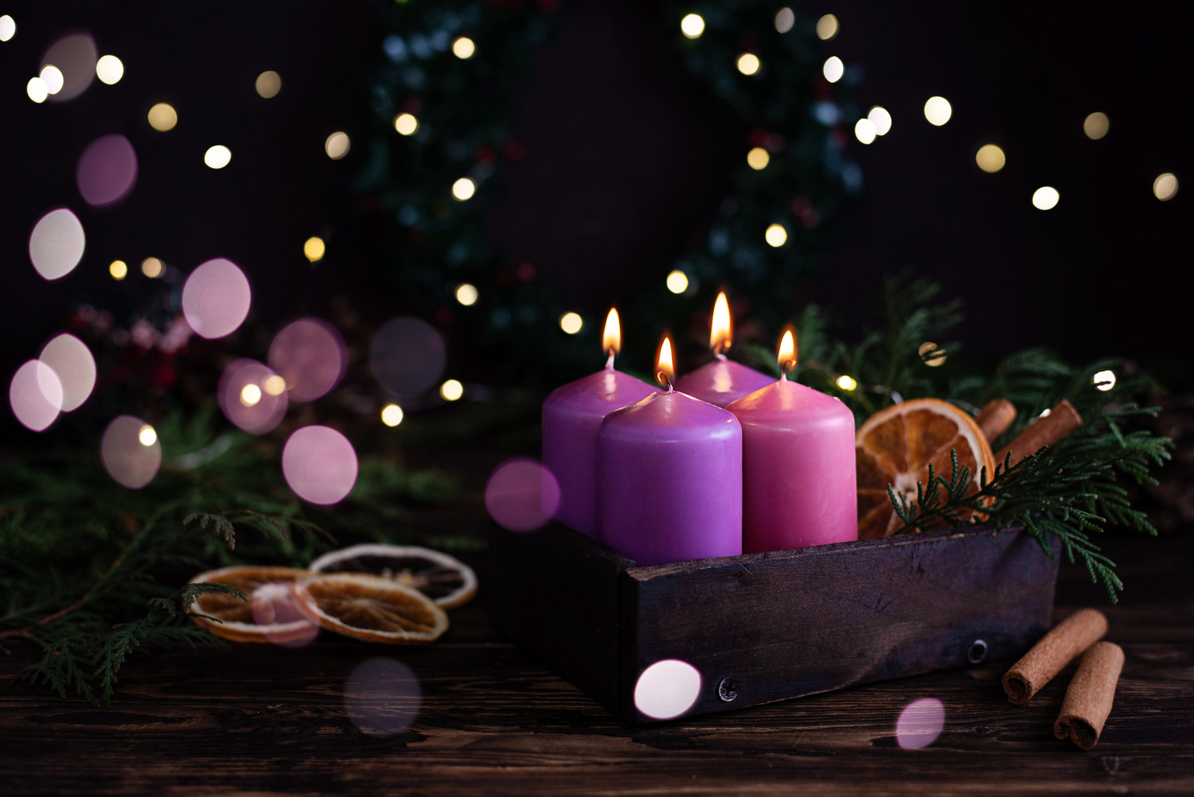 Four purple burning advent candles, Christmas eve.